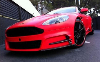 Matte Red Wrap Aston Martin DBS auto wrappen